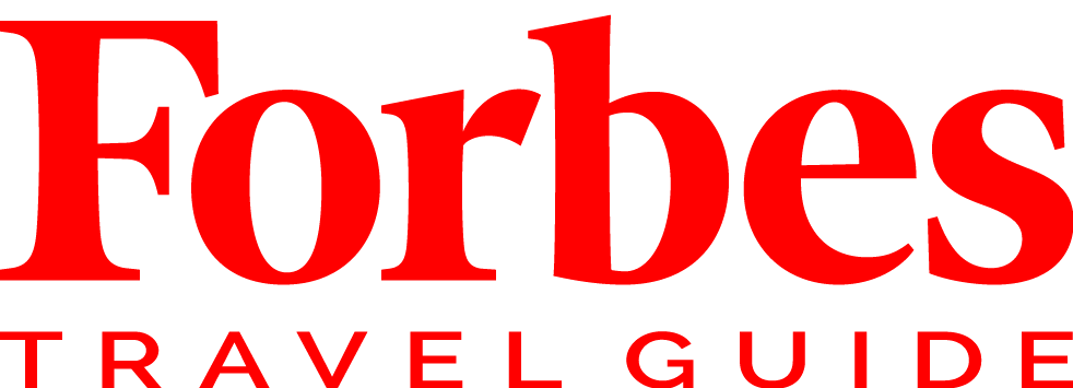 Forbes Travel Guide logo in red on a white background