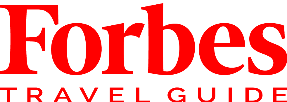 Forbes Travel Guide logo in red on a white background