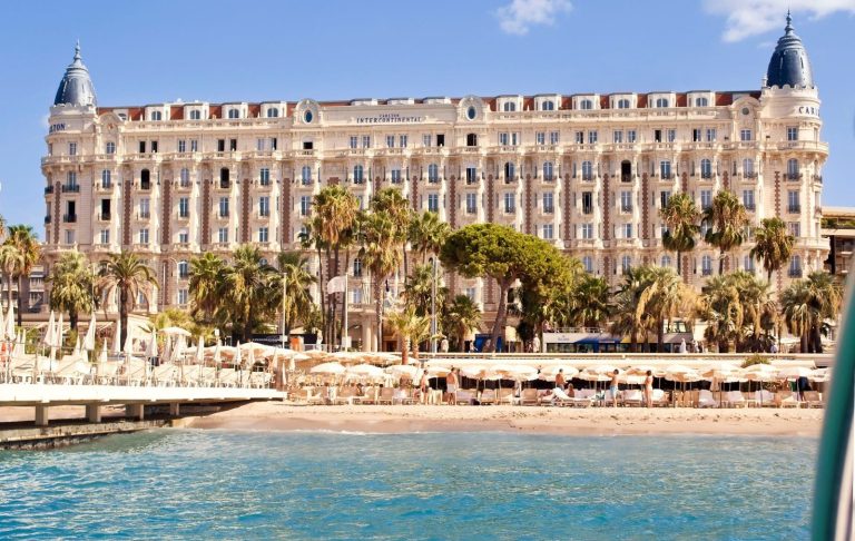 Hotel Carlton Cannes seen from the sea with its beach
